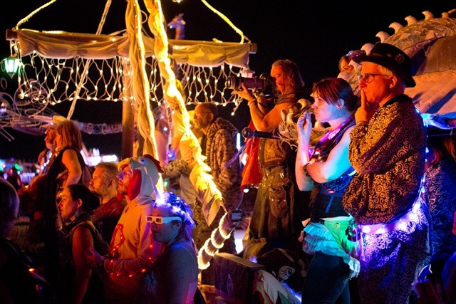 Members of camp, watching a burn.